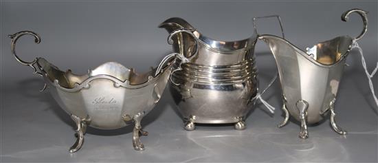 A George III silver cream jug and a George V sucrier and cream jug, Sheffield 1918.